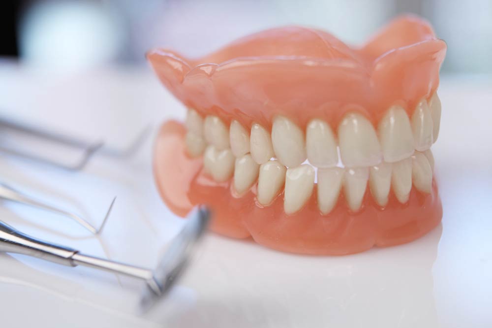 Clean dentures