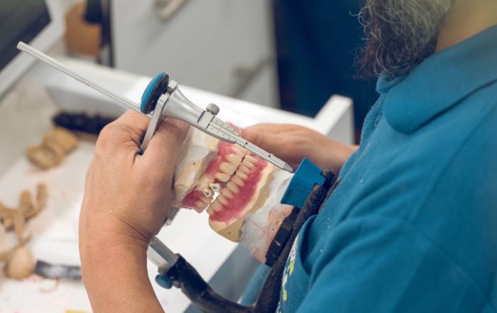 crop senior male technician fixing jaw dentures in 2022 01 29 05 59 58 utc 6