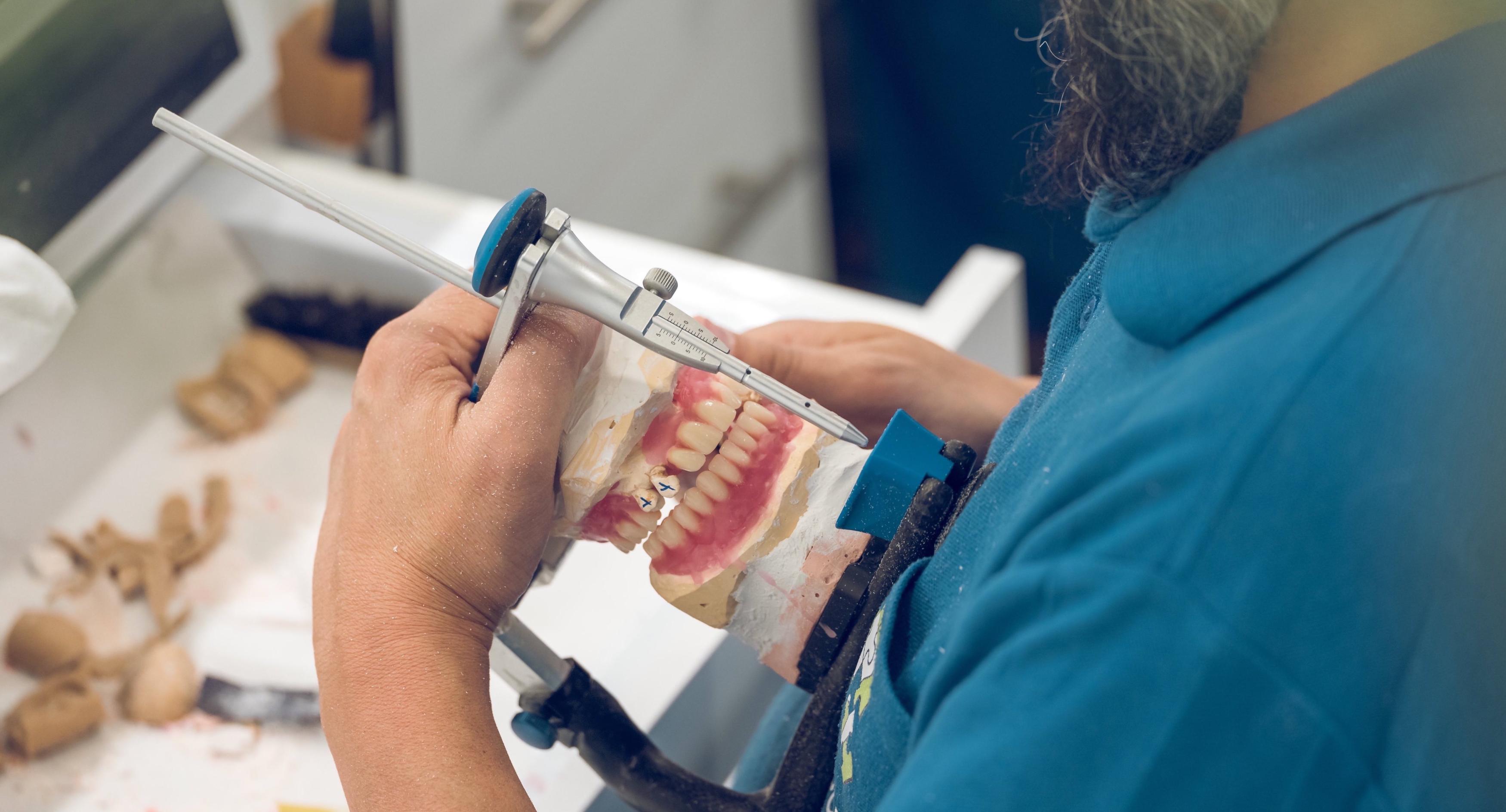 crop senior male technician fixing jaw dentures in 2022 01 29 05 59 58 utc 6 scaled