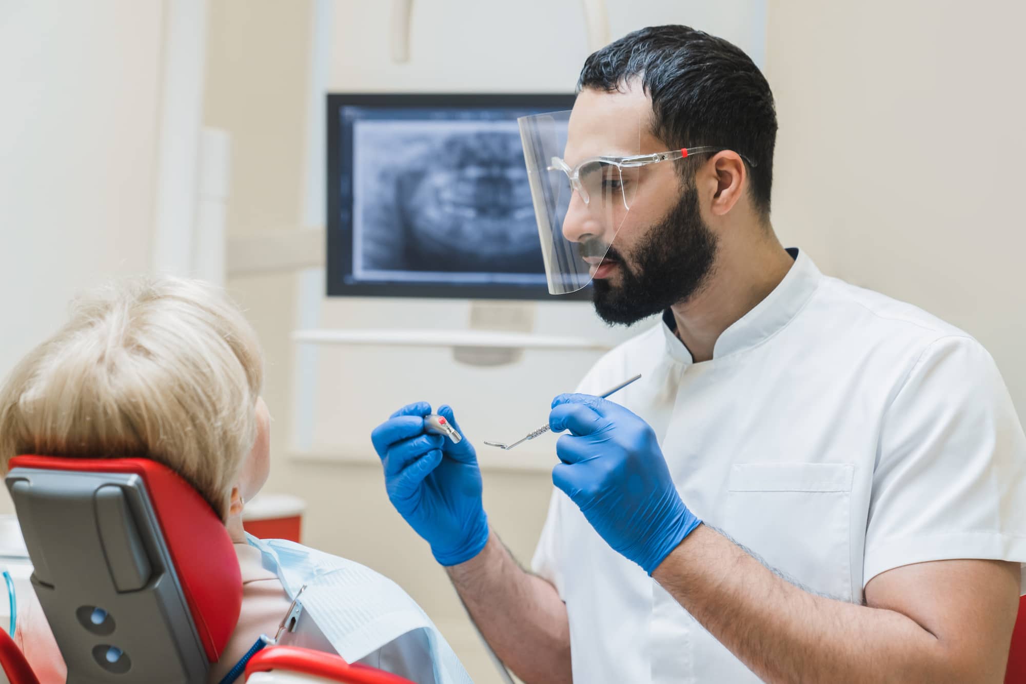 Dentist examining a patient for gum disease.