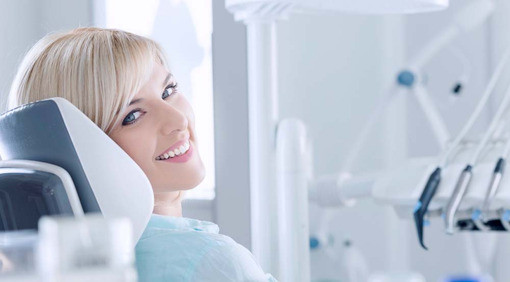 Woman smiling at dental office