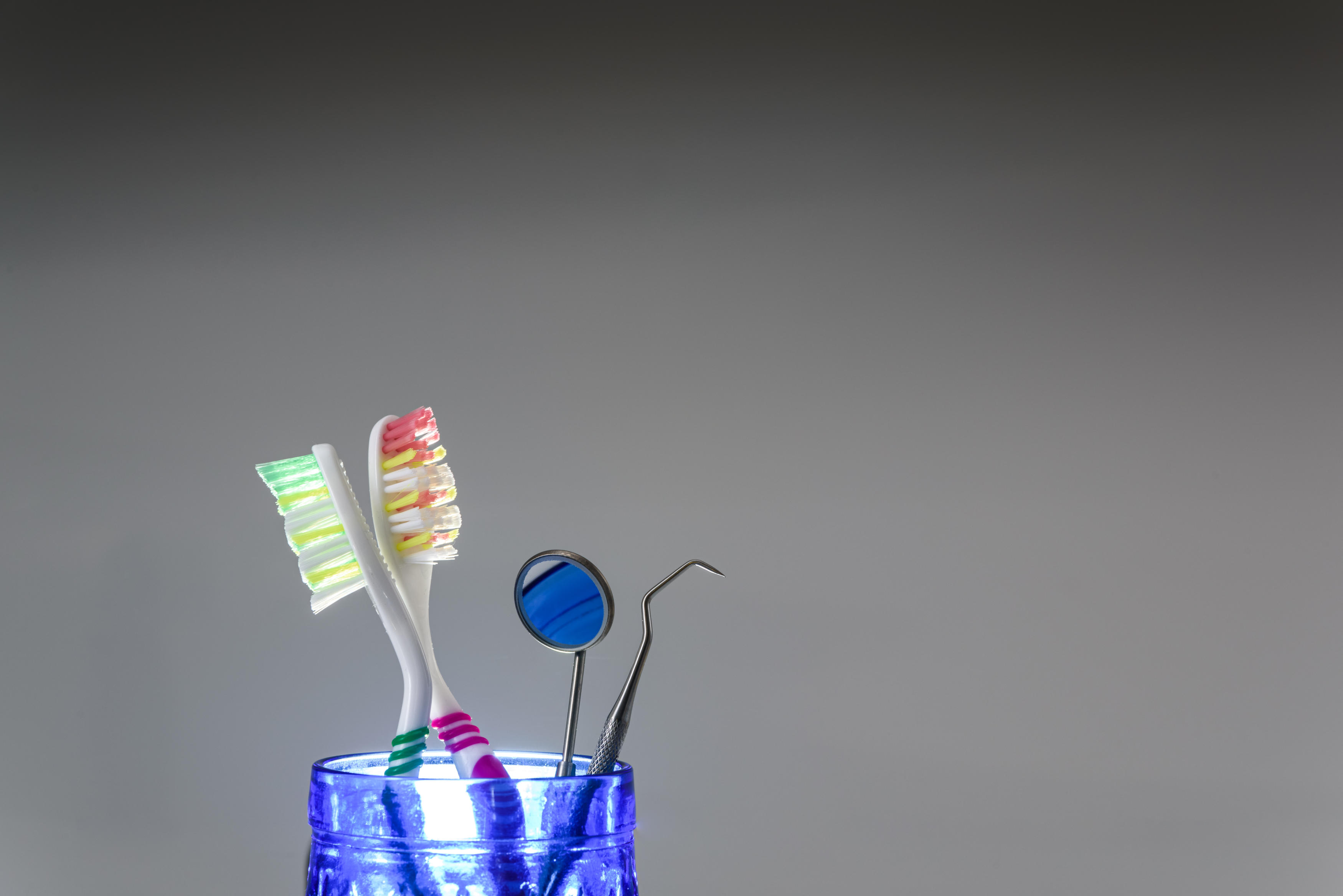 toothbrushes and dentist set isolated on gray back 2022 05 03 22 33 50 utc 2 scaled